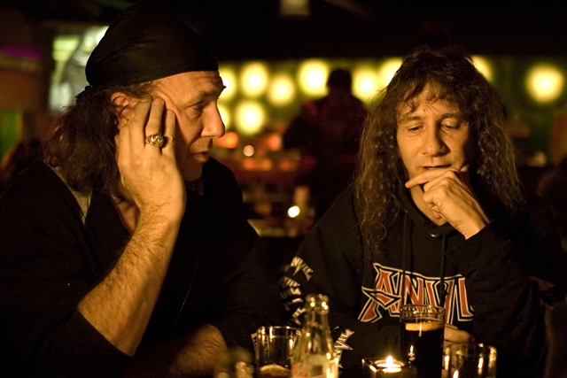 Anvil co-founders Robb Reiner (L) and Steve “Lips” Ludlow contemplate their band’s future in a scene from Sacha Gervasi’s feature documentary, Anvil! The Story Of Anvil.